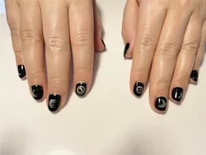 Short black nails with grey and silver swirled marble accent detailing