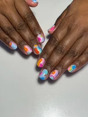 Short nails with abstract marble swirls in pink, blue, orange and turquoise