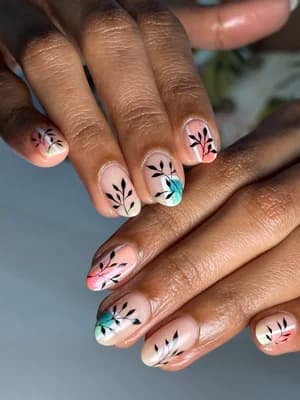 Sheer nude nails with fine black botanical branch line work and pastel watercolor leaf accents