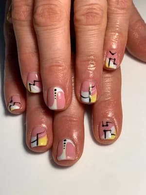 Short nails with abstract Memphis-style geometric shapes in pink, white, black, and yellow line work
