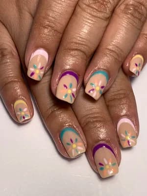 Nude nails with multicolor hand-painted daisy flowers and purple, teal cuticle outlines
