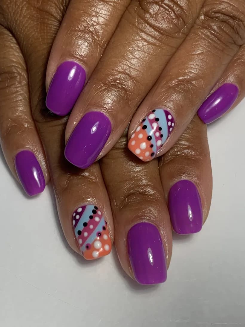 Colorful hand-painted nail-art design set representing Level 2 work.