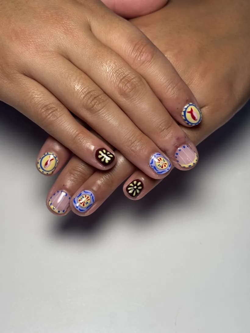 Detailed multi-color hand-painted nail-art design set representing Level 3 work.